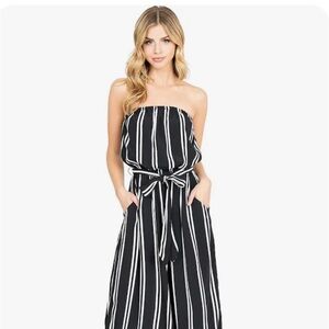 NWOT Striped culotte jumpsuit. Side pockets attached belt Strapless style NWOT